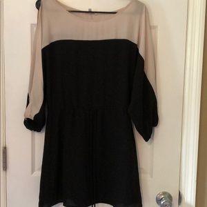Boutique black and cream dress with open arms